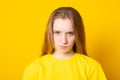 Portrait of grumpy or annoyed teen girl looking at the camera with sad or unhappy expression on her face while having some problem Royalty Free Stock Photo