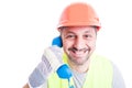 Closeup portrait of handsome builder talking on telephone