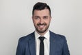 Closeup Portrait of a handsome businessman smiling at the camera. dressed in a suit.  on a white background Royalty Free Stock Photo