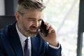 Closeup Portrait Of Handsome Middle Aged Businessman Making Phone Call In Office Royalty Free Stock Photo