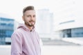 Closeup portrait of handsome smiling young man, Cheerful businessman in a city Royalty Free Stock Photo