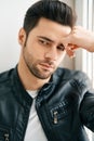 Closeup portrait of handsome thoughtful man posing on white studio background Royalty Free Stock Photo