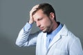 Closeup portrait of handsome worried young doctor Royalty Free Stock Photo