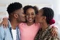 Closeup portrait of happy black family greeting mother soldier Royalty Free Stock Photo