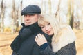 Closeup portrait of happy blonde mature woman and beautiful middle-aged brunette, looking directly at camera. Loving couple of 45- Royalty Free Stock Photo