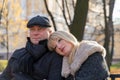 Closeup portrait of happy blonde mature woman and beautiful middle-aged brunette, looking away. Loving couple of 45-50 years old Royalty Free Stock Photo