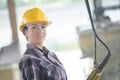 Closeup portrait happy female construction worker at site Royalty Free Stock Photo