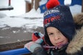 closeup portrait of happy laughing children in winter clothes outside playing in the snow drifts on the bright colorful Royalty Free Stock Photo