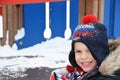 closeup portrait of happy laughing children in winter clothes outside playing in the snow drifts on the bright colorful Royalty Free Stock Photo