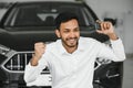 Closeup portrait happy, smiling, young man, buyer showing keys of his new car Royalty Free Stock Photo