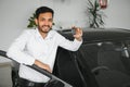 Closeup portrait happy, smiling, young man, buyer showing keys of his new car Royalty Free Stock Photo