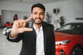 Closeup portrait happy, smiling, young man, buyer showing keys of his new car Royalty Free Stock Photo