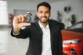 Closeup portrait happy, smiling, young man, buyer showing keys of his new car Royalty Free Stock Photo