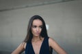 Closeup portrait of a happy young brunette teenage girl outdoor. concrete wall on background Royalty Free Stock Photo