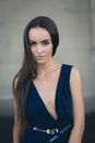 Closeup portrait of a happy young brunette teenage girl outdoor. concrete wall on background Royalty Free Stock Photo