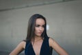 Closeup portrait of a happy young brunette teenage girl outdoor. concrete wall on background Royalty Free Stock Photo