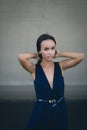 Closeup portrait of a happy young brunette teenage girl outdoor. concrete wall on background Royalty Free Stock Photo