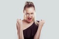 Closeup portrait head shot angry young woman having nervous breakdown screaming isolated white wall background. Negative human Royalty Free Stock Photo
