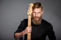 Closeup portrait of hipster man with guitar Royalty Free Stock Photo