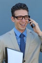 Closeup portrait of laughing young business man with glasses and wide open mouth talking on mobile phone outdoors Royalty Free Stock Photo