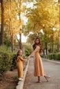 Closeup portrait of a little baby girl and mother on wheat summer field. Adventure, travel, tourism, hike and people concept - Royalty Free Stock Photo