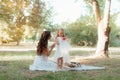 Closeup portrait of a little baby girl and mother on wheat summer field. Happy childhood concept Royalty Free Stock Photo