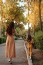 Closeup portrait of a little baby girl and mother on wheat summer field. Happy childhood concept Royalty Free Stock Photo