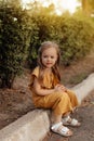 Closeup portrait of a little baby girl on wheat summer field. Adventure, travel, tourism, hike and people concept - happy family Royalty Free Stock Photo