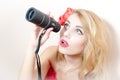 Closeup portrait on looking peering in spyglass telescope beautiful glamor young blond pinup woman attractive girl having fun Royalty Free Stock Photo