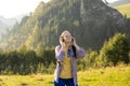 Closeup portrait of a lovely young girl listening to music through wireless earphones on nature background. Music lover Royalty Free Stock Photo