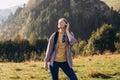 Closeup portrait of a lovely young girl listening to music through wireless earphones on nature background. Music lover Royalty Free Stock Photo