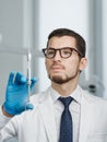 Closeup portrait of male doctor holding cartridge syringe