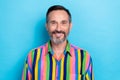 Closeup portrait of mature toothy beaming smile man wear bright colorful striped shirt enjoy his health conditions Royalty Free Stock Photo