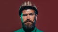 Closeup portrait of mechanical worker in safety helmet. Handsome bearded man in hardhat. Serious architect, engineer or Royalty Free Stock Photo