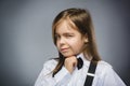 Closeup Portrait of mistrust girl isolated on gray background