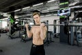 Closeup portrait of a muscular man workout with barbell at gym Royalty Free Stock Photo