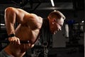 Closeup portrait of a muscular man workout with barbell at gym. Brutal bodybuilder athletic man with six pack, perfect Royalty Free Stock Photo