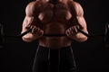 Closeup portrait of a muscular man workout with barbell at gym. Royalty Free Stock Photo