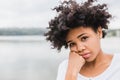 Closeup portrait of pensive beautiful African American young woman posing outdoors, have sad face. Beautiful young dark-skinned Royalty Free Stock Photo