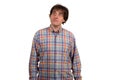 Closeup portrait of pensive young man in checkered shirt. Royalty Free Stock Photo
