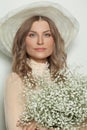 Closeup portrait of perfect woman in white hat. Beautiful female face Royalty Free Stock Photo