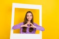 Closeup portrait photo of young adorable girlfriend smiling showing love heart feelings her boyfriend cadre frame Royalty Free Stock Photo