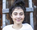 Closeup portrait of a positive teen girl with black hair