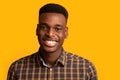 Closeup portrait of positive young African American guy sincerely smiling at camera Royalty Free Stock Photo