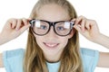 Closeup portrait of a preteen girl in big glasses, studio shot, isolated on white background