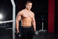 Closeup portrait of professional bodybuilder workout with barbell at gym. Confident muscular man training . Looking Royalty Free Stock Photo