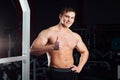 Closeup portrait of professional bodybuilder workout with barbell at gym. Confident muscular man training . Looking Royalty Free Stock Photo
