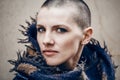 Closeup portrait of sad beautiful Caucasian white young bald girl woman with shaved hair head in leather jacket and scarf Royalty Free Stock Photo