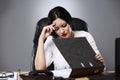 Closeup portrait, sad young woman in white gray suit sitting on Royalty Free Stock Photo