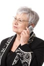 Closeup portrait of senior lady with mobile phone Royalty Free Stock Photo